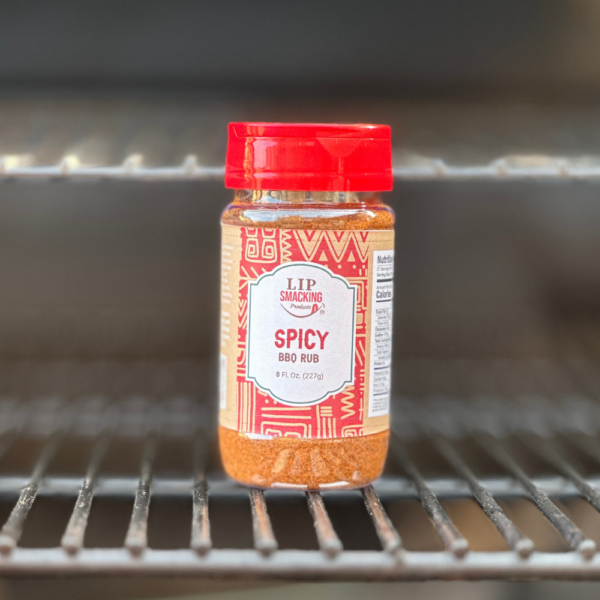 Image of a bottle of Spicy BBQ Rub on a grill